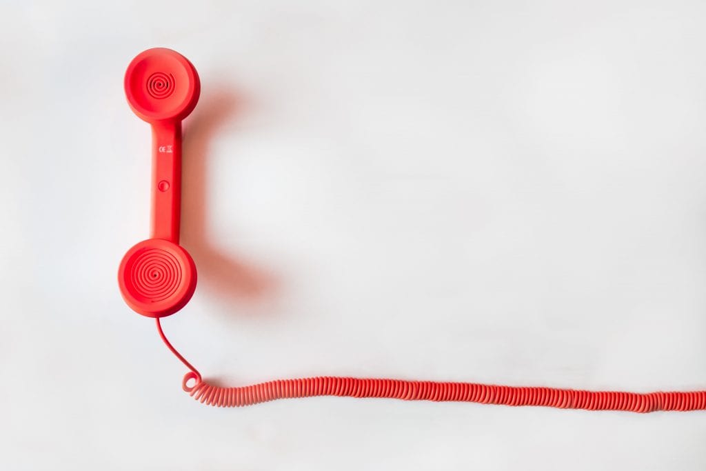 (credit negative space) red corded phone